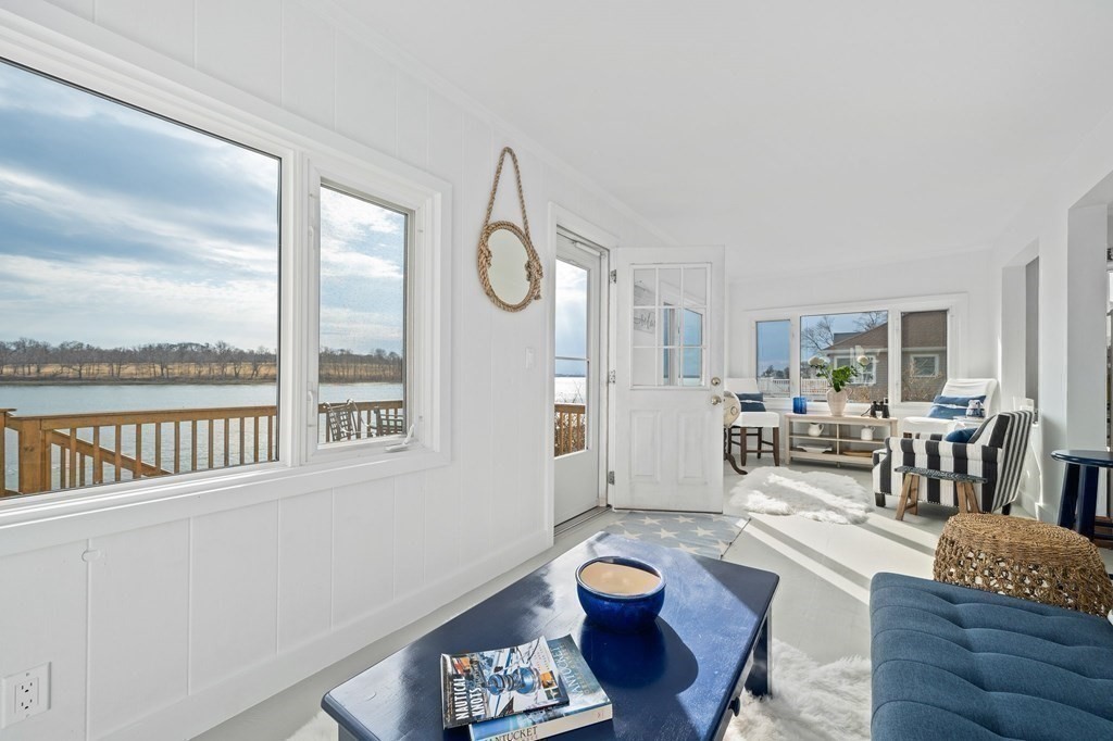121 Edgewater Road Hull, MA 02045 - Photo 16 of 42 a living room with furniture and a large window