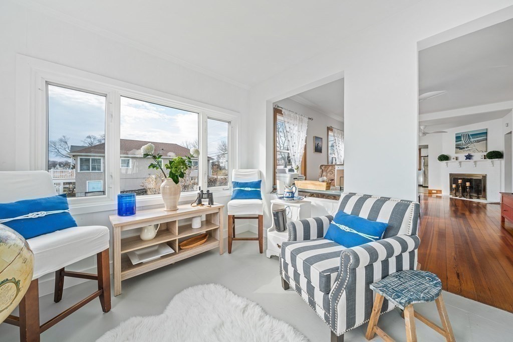 121 Edgewater Road Hull, MA 02045 - Photo 17 of 42 a living room with furniture and a wooden floor
