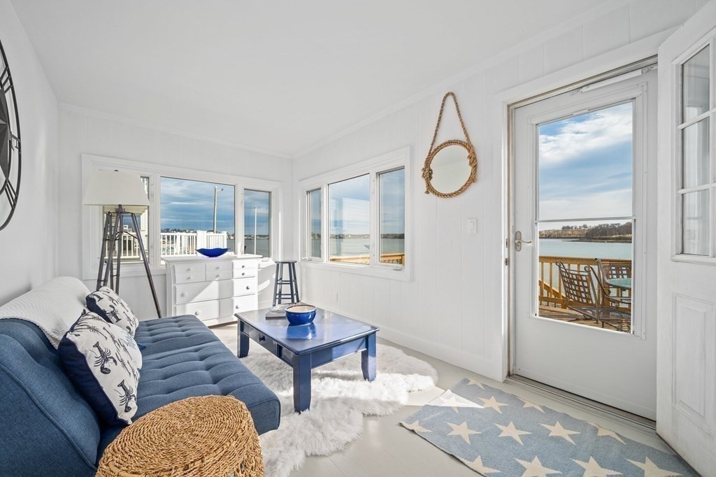 121 Edgewater Road Hull, MA 02045 - Photo 19 of 42 a living room with furniture a rug and a window