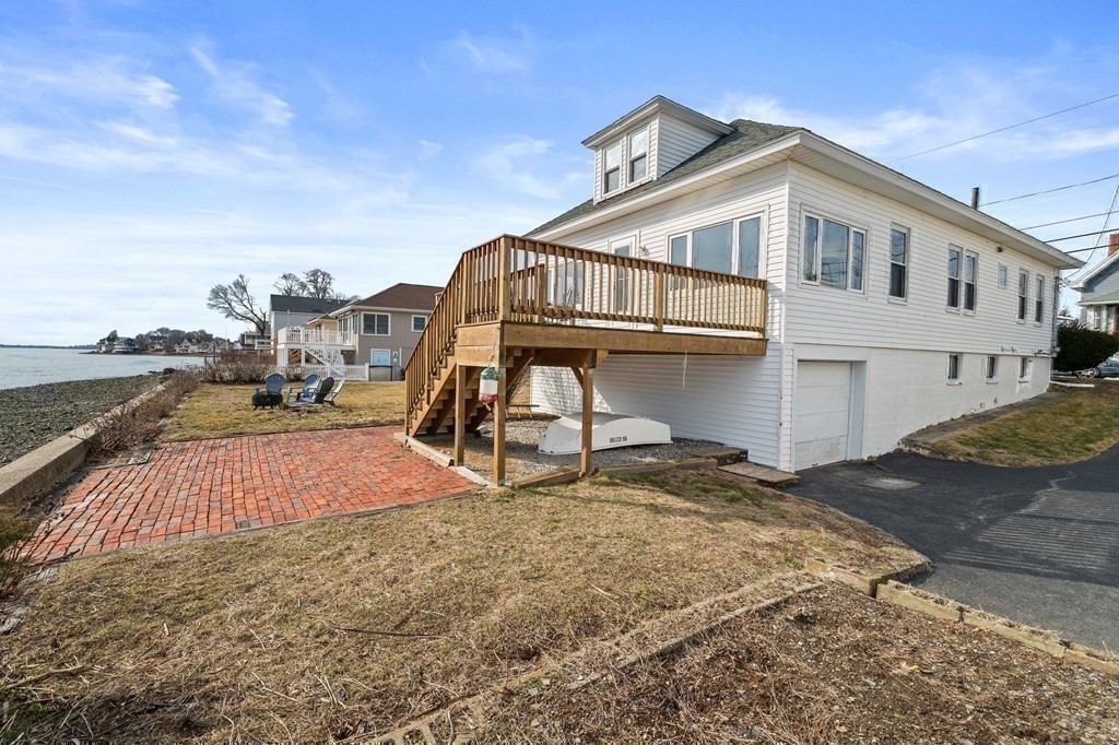 121 Edgewater Road Hull, MA 02045 - Photo 28 of 42 a view of a house with a yard