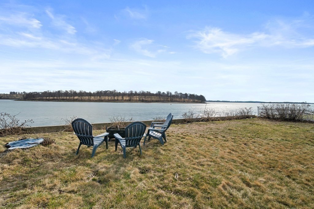 121 Edgewater Road Hull, MA 02045 - Photo 30 of 42 a view of a lake with furniture