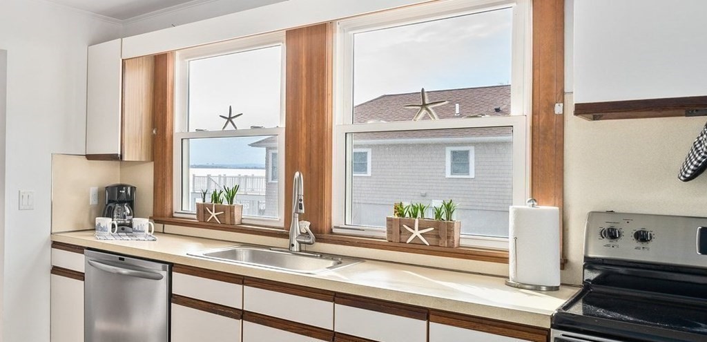121 Edgewater Road Hull, MA 02045 - Photo 4 of 42 a kitchen with a sink and a window