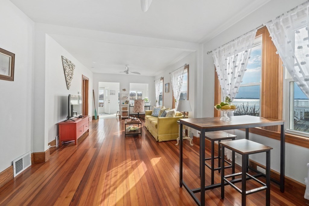 121 Edgewater Road Hull, MA 02045 - Photo 6 of 42 a view of a dining room with furniture window and wooden floor