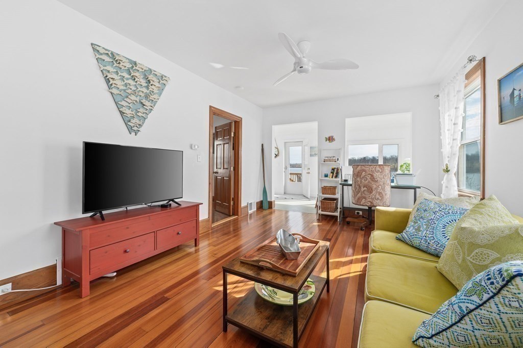 121 Edgewater Road Hull, MA 02045 - Photo 9 of 42 a living room with furniture and a flat screen tv