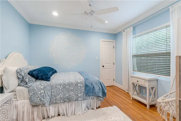 a bedroom with a bed next to a window with the outer view