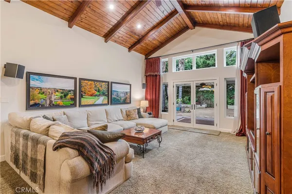 a bedroom with furniture and a large window
