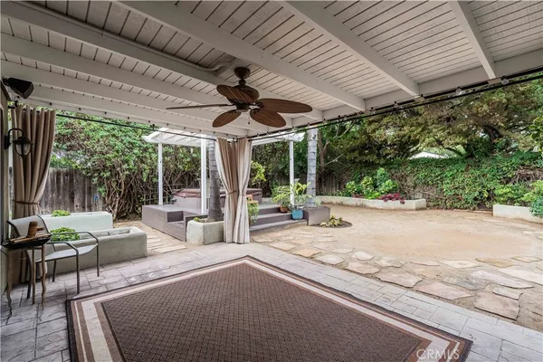 a swimming pool with outdoor seating and yard