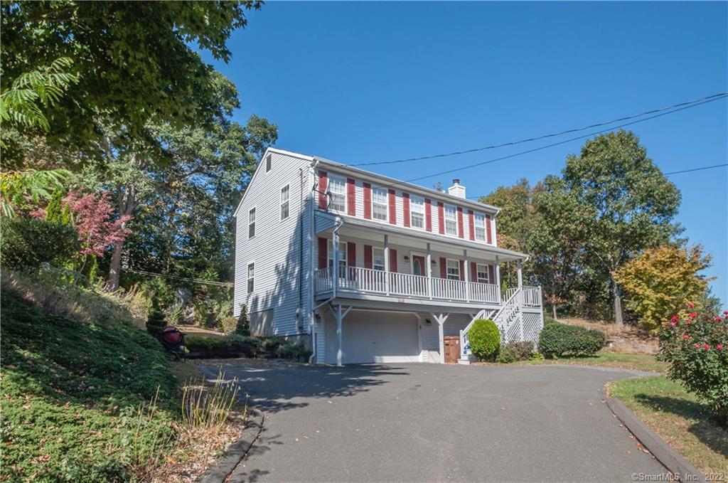 112 Perry Hill Road Shelton, CT 06484 - Photo 1 of 1 a front view of a house with a garden and plants