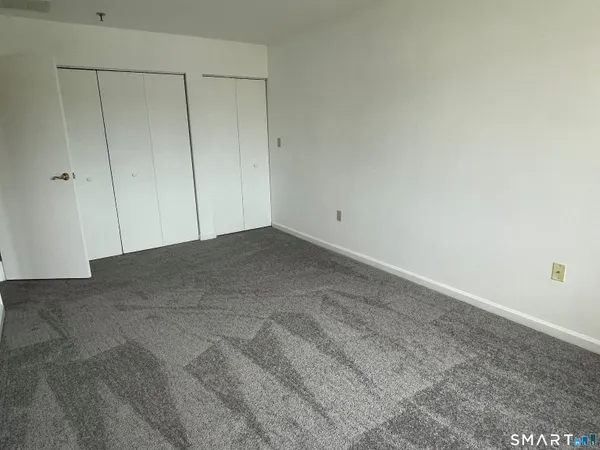 a kitchen with white cabinets stainless steel appliances and sink