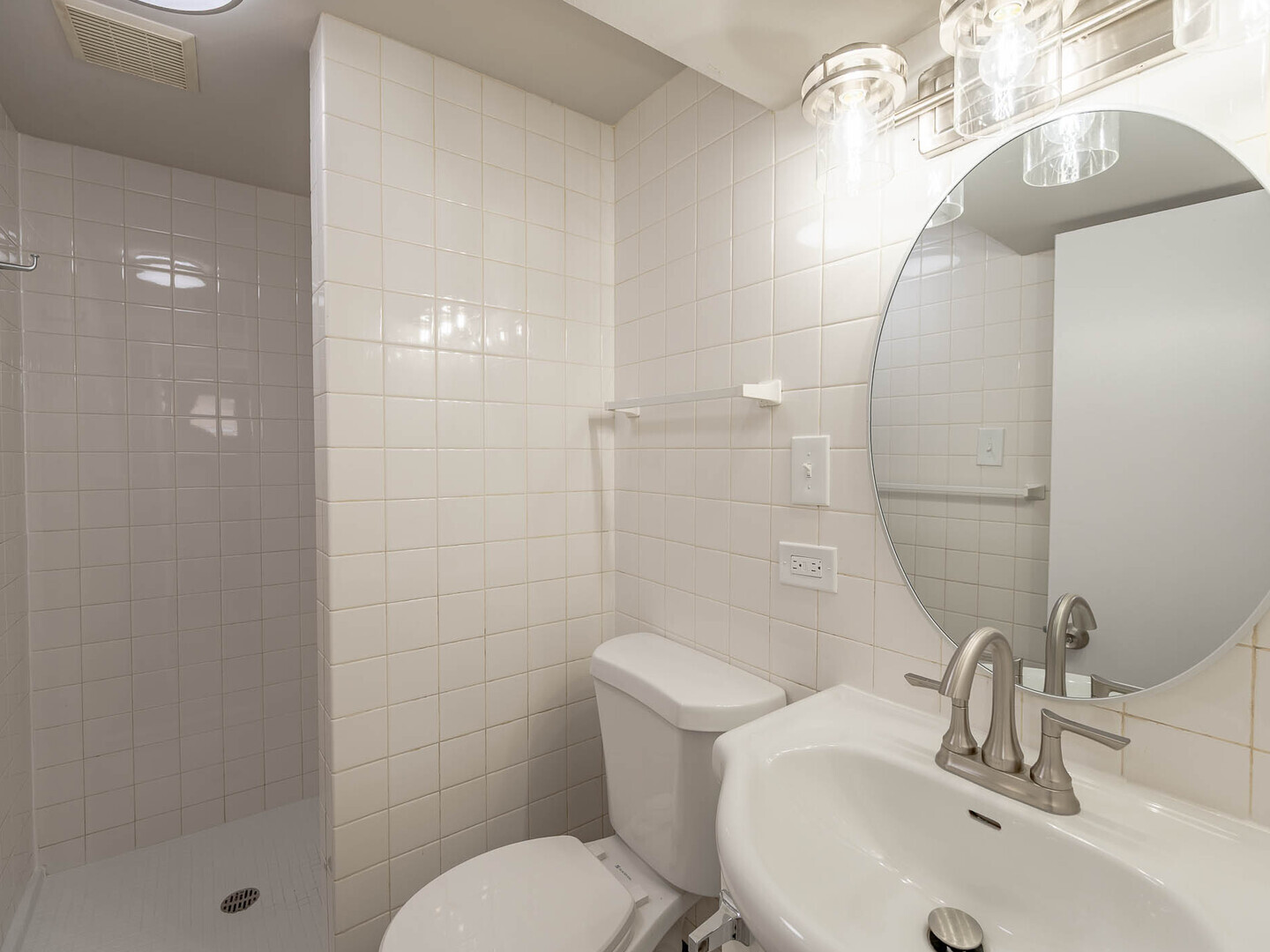 2304 Oakton Street Park Ridge, IL 60068 - Photo 11 of 14 a bathroom with a sink toilet and shower