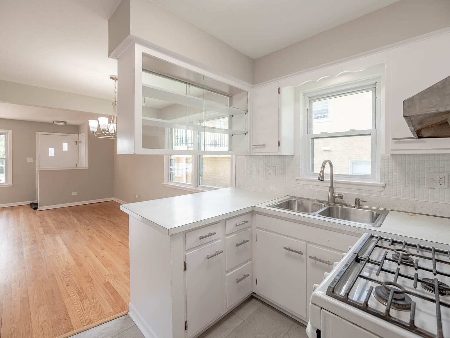2304 Oakton Street Park Ridge, IL 60068 - Photo 3 of 14 a kitchen with white cabinets and appliances