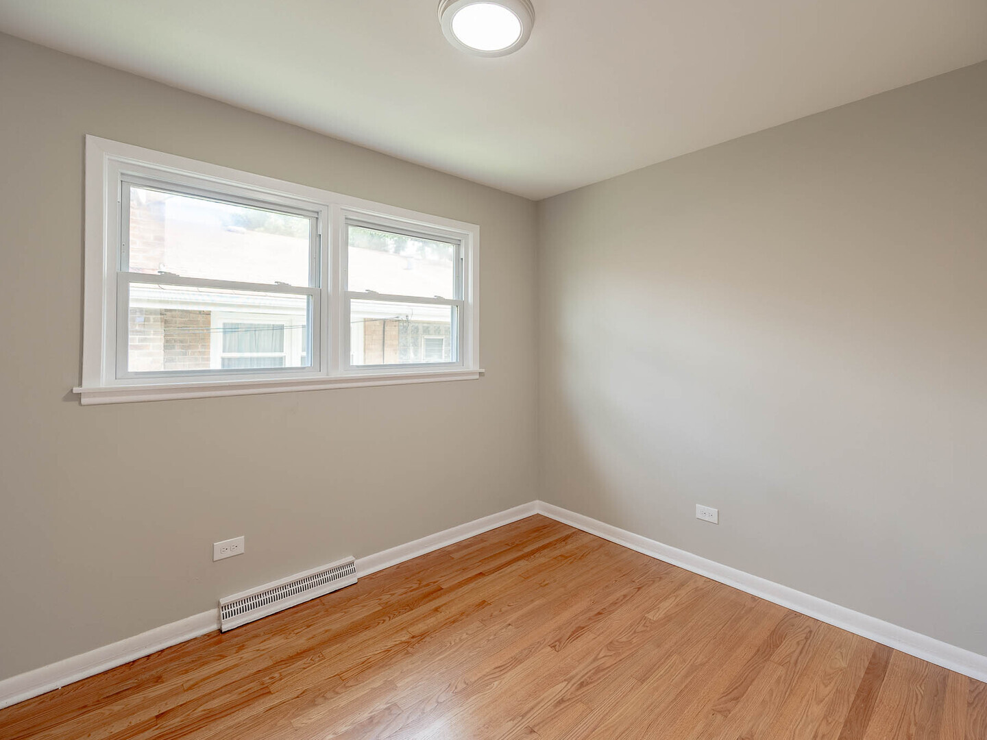 2304 Oakton Street Park Ridge, IL 60068 - Photo 6 of 14 a view of a room with wooden floor and windows