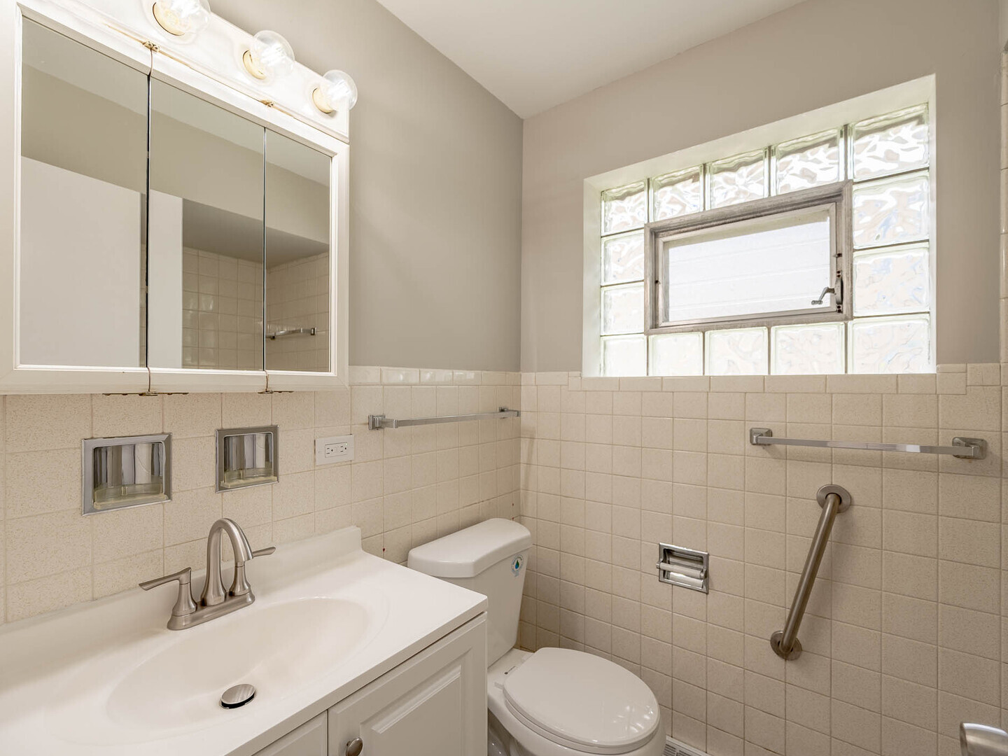 2304 Oakton Street Park Ridge, IL 60068 - Photo 9 of 14 a bathroom with a sink mirror vanity and toilet
