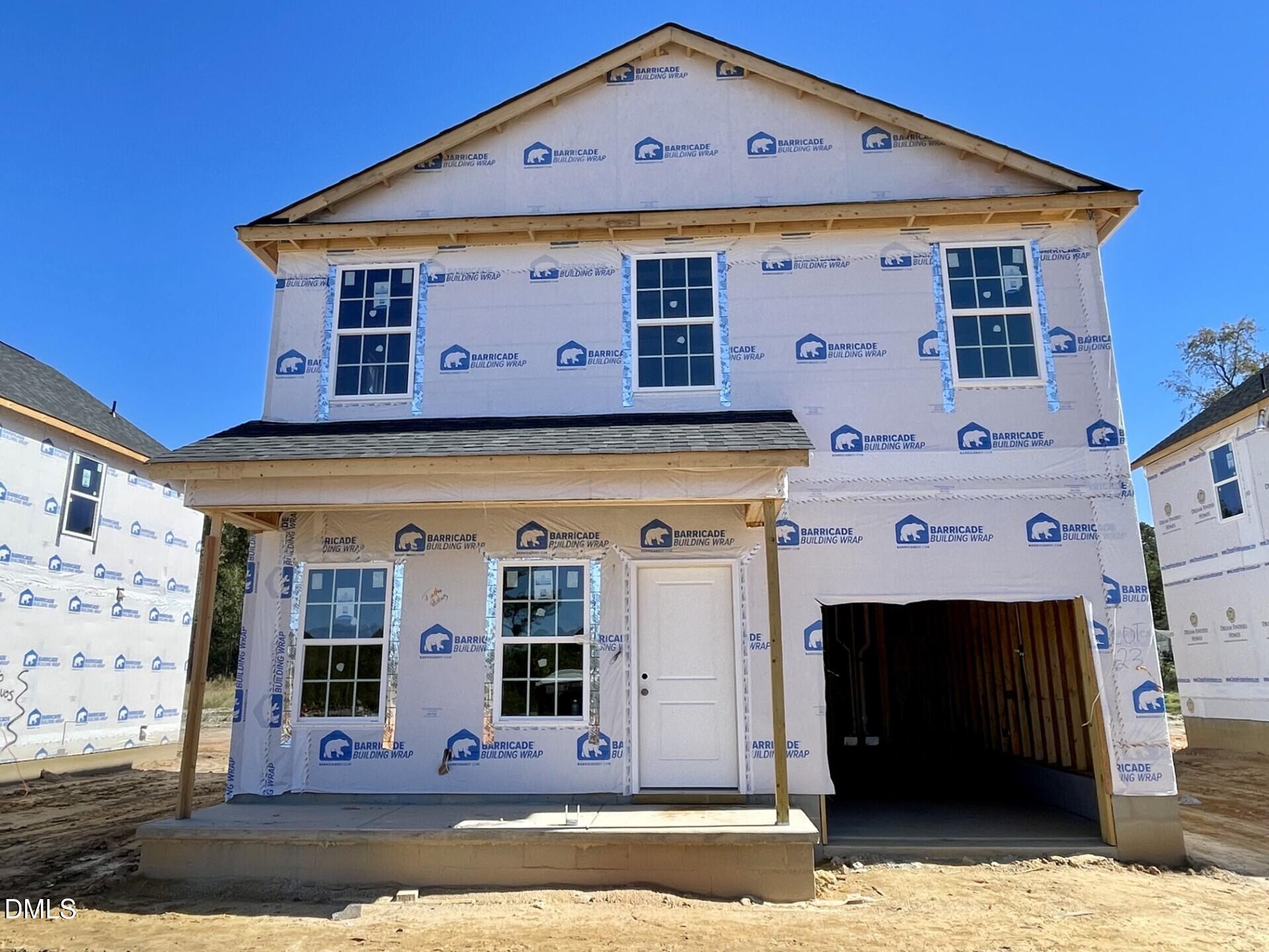 68 Stout Landing Dunn, NC 28334 - Photo 2 of 4 a front view of a house with a garage