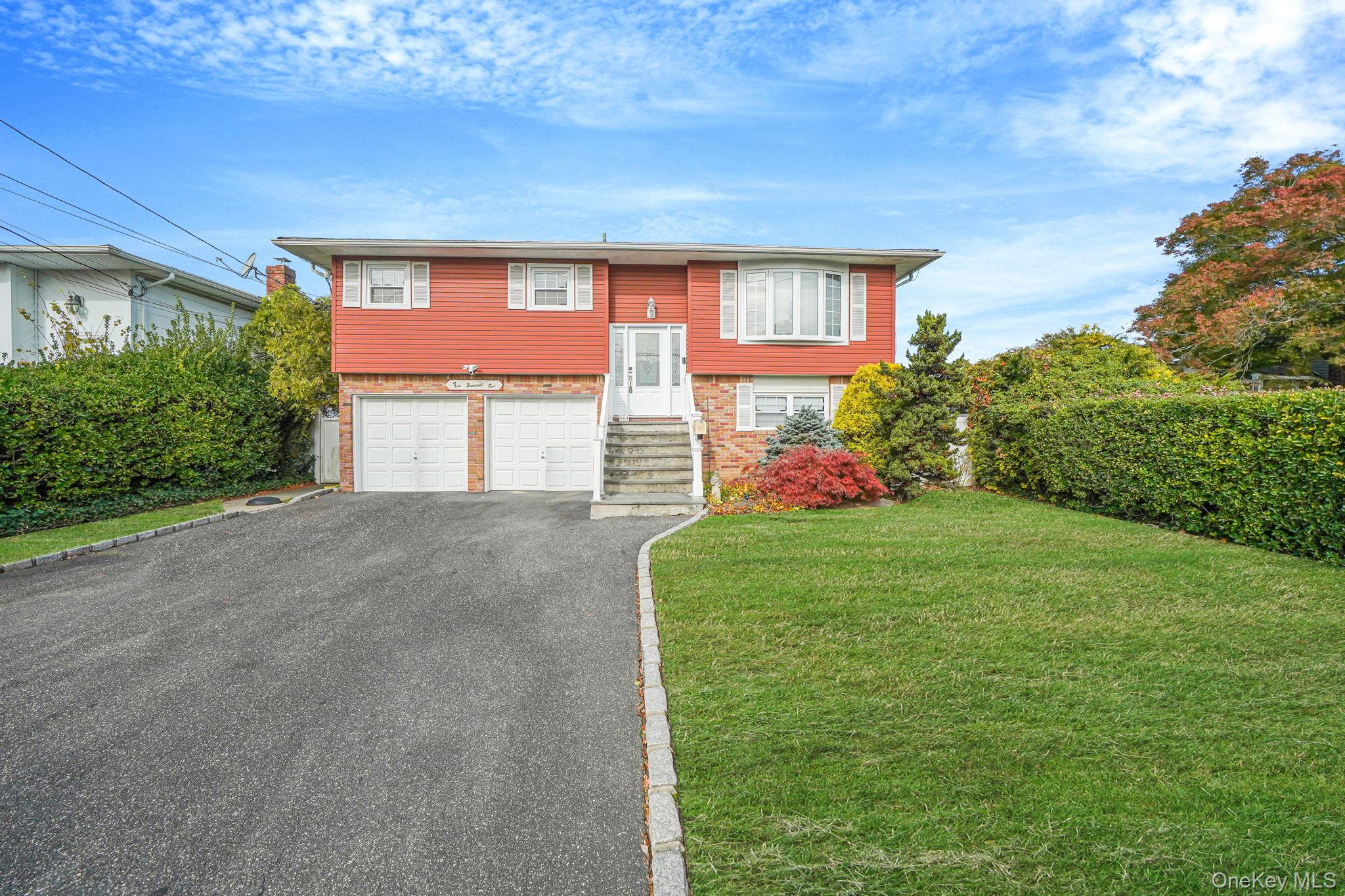 501 Windmill Avenue West Babylon, NY 11704 - Photo 1 of 35 a front view of a house with garden