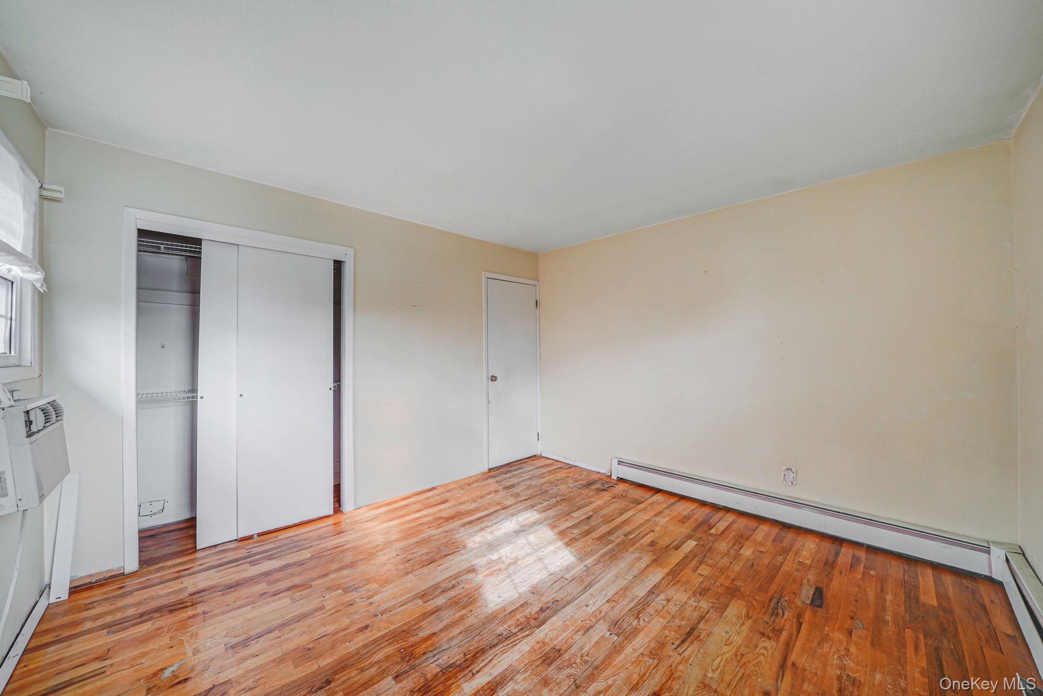 501 Windmill Avenue West Babylon, NY 11704 - Photo 19 of 35 a view of empty room with wooden floor