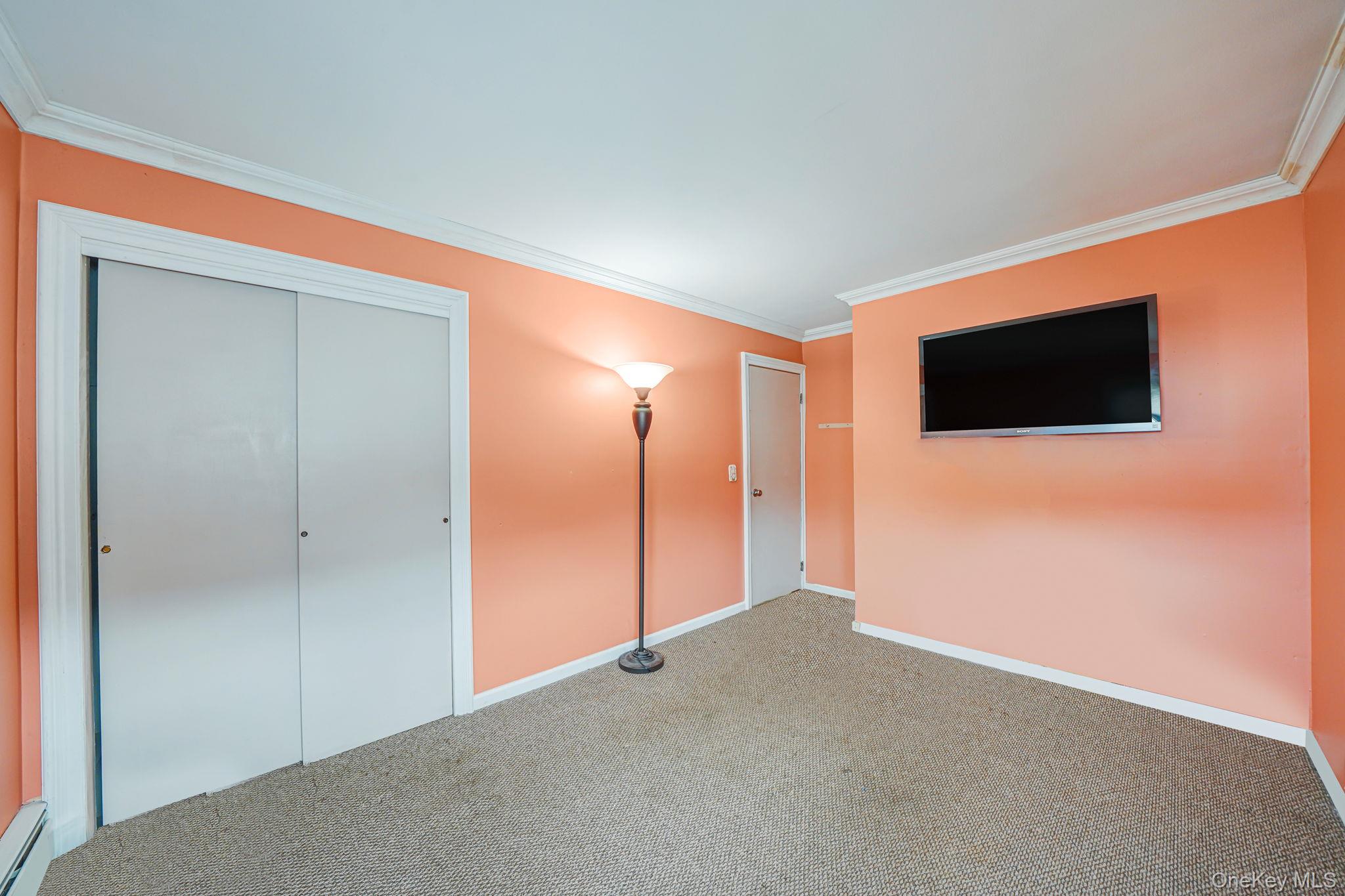 501 Windmill Avenue West Babylon, NY 11704 - Photo 21 of 35 a view of a livingroom with a flat screen tv