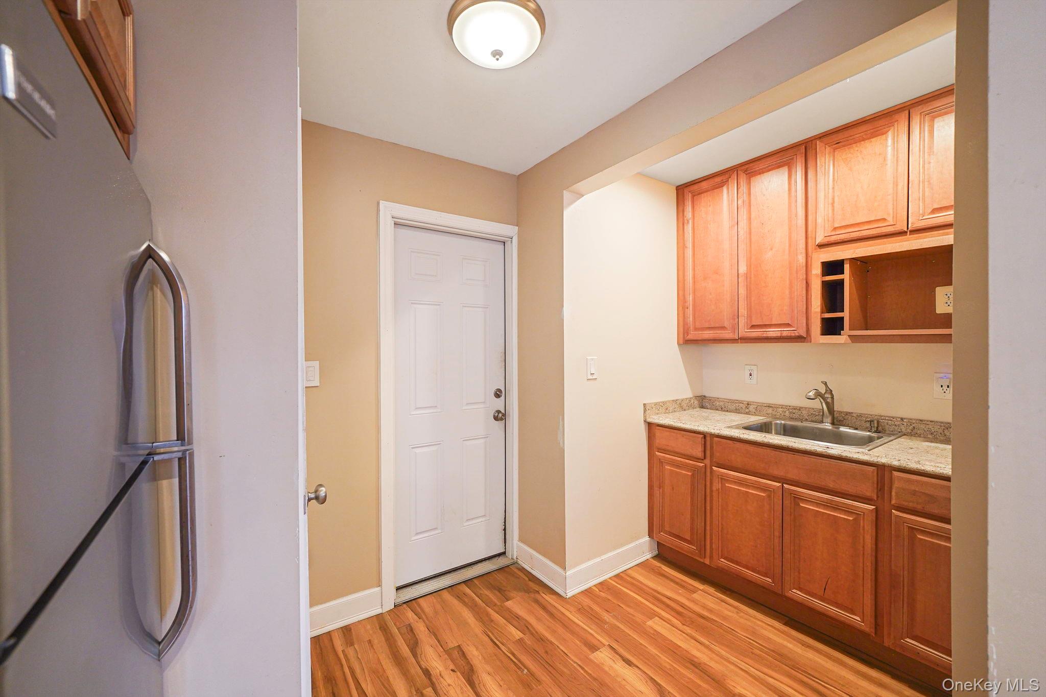 501 Windmill Avenue West Babylon, NY 11704 - Photo 29 of 35 a kitchen with stainless steel appliances granite countertop a refrigerator and a sink