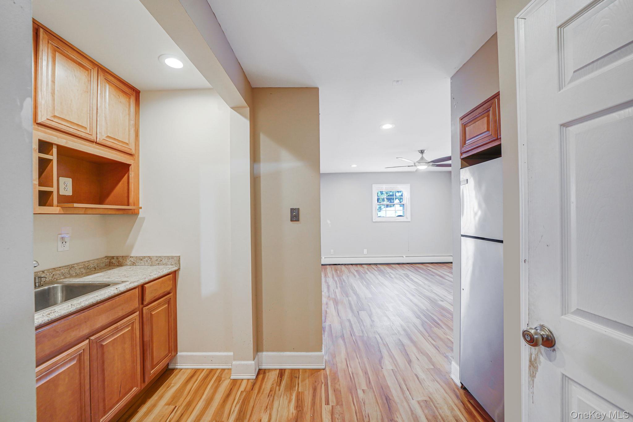 501 Windmill Avenue West Babylon, NY 11704 - Photo 35 of 35 a view of hallway with wooden floor and seating space