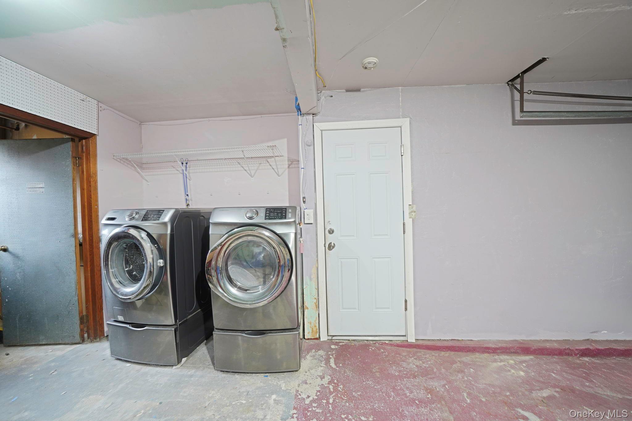 501 Windmill Avenue West Babylon, NY 11704 - Photo 31 of 35 a utility room with sink dryer and washer