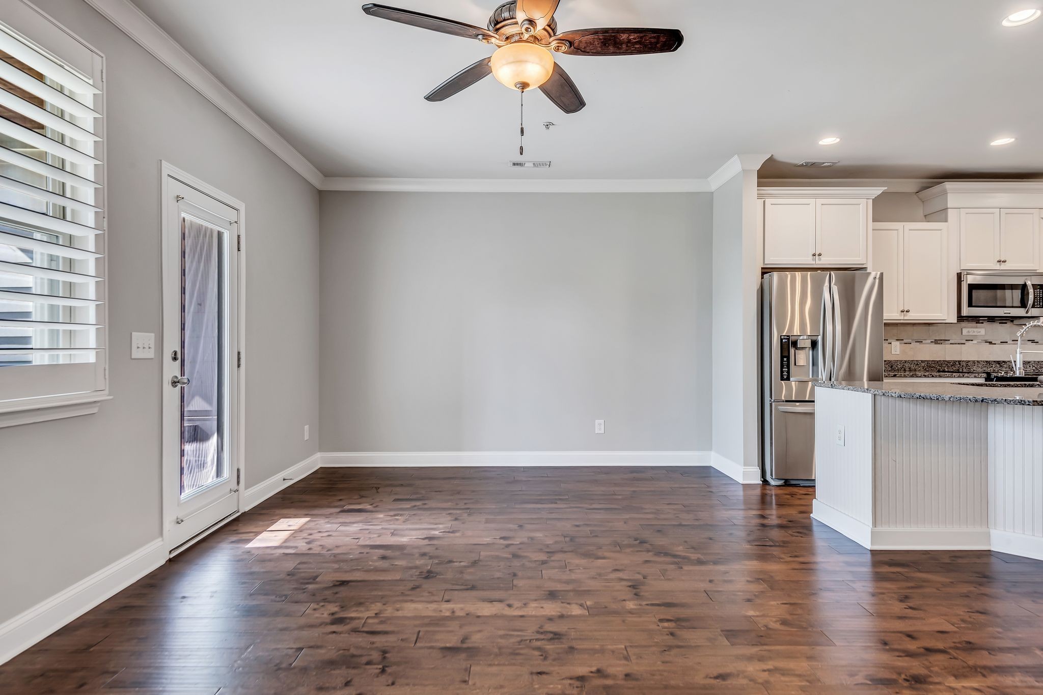 1477 Channing Drive Thompson's Station, TN 37179 - Photo 16 of 33 a view of a kitchen with a sink refrigerator and wooden floor