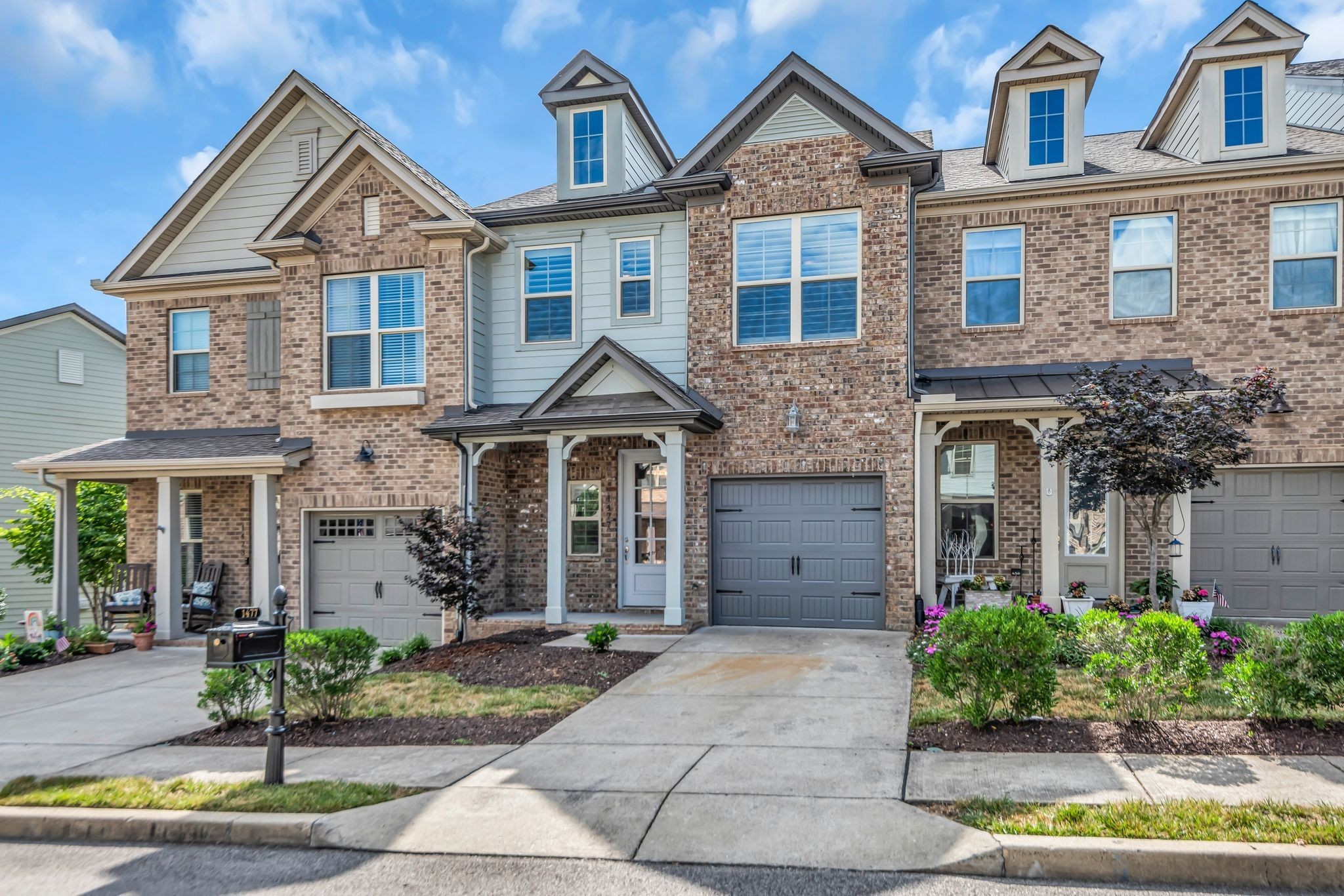 1477 Channing Drive Thompson's Station, TN 37179 - Photo 2 of 33 a front view of a house with garden