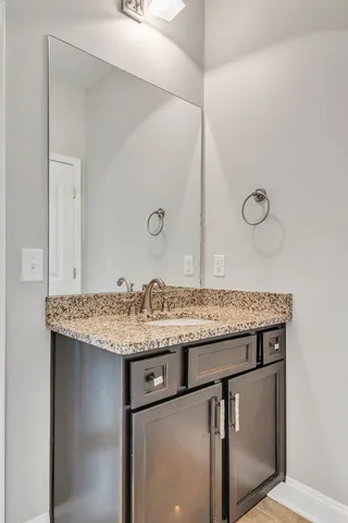 a sink sitting next to a bathroom sink