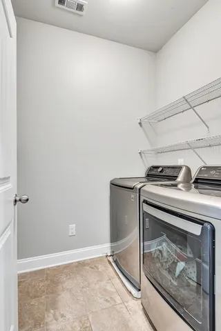 a utility room with washer and dryer