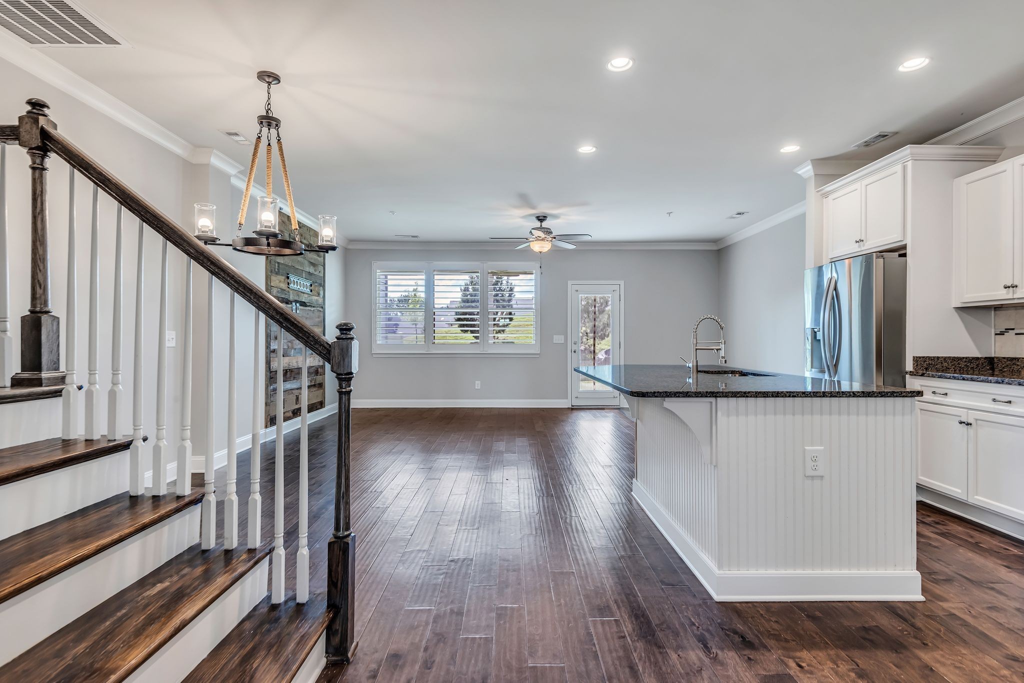 1477 Channing Drive Thompson's Station, TN 37179 - Photo 8 of 33 a view of a kitchen with wooden floor and staircase