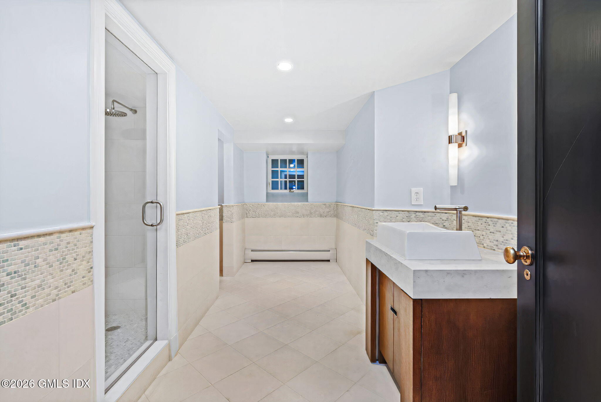 164 Round Hill Road Greenwich, CT 06831 - Photo 47 of 67 a bathroom with a sink and a mirror