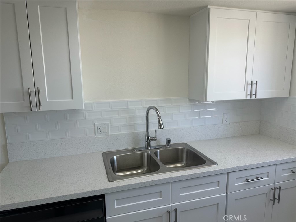 44155 10th Lancaster, CA 93534 - Photo 2 of 15 a kitchen with a sink and cabinets