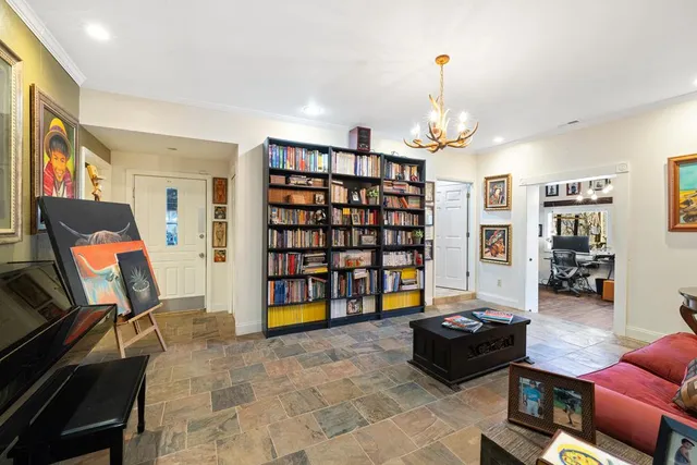 a bathroom with a granite countertop toilet a sink and mirror