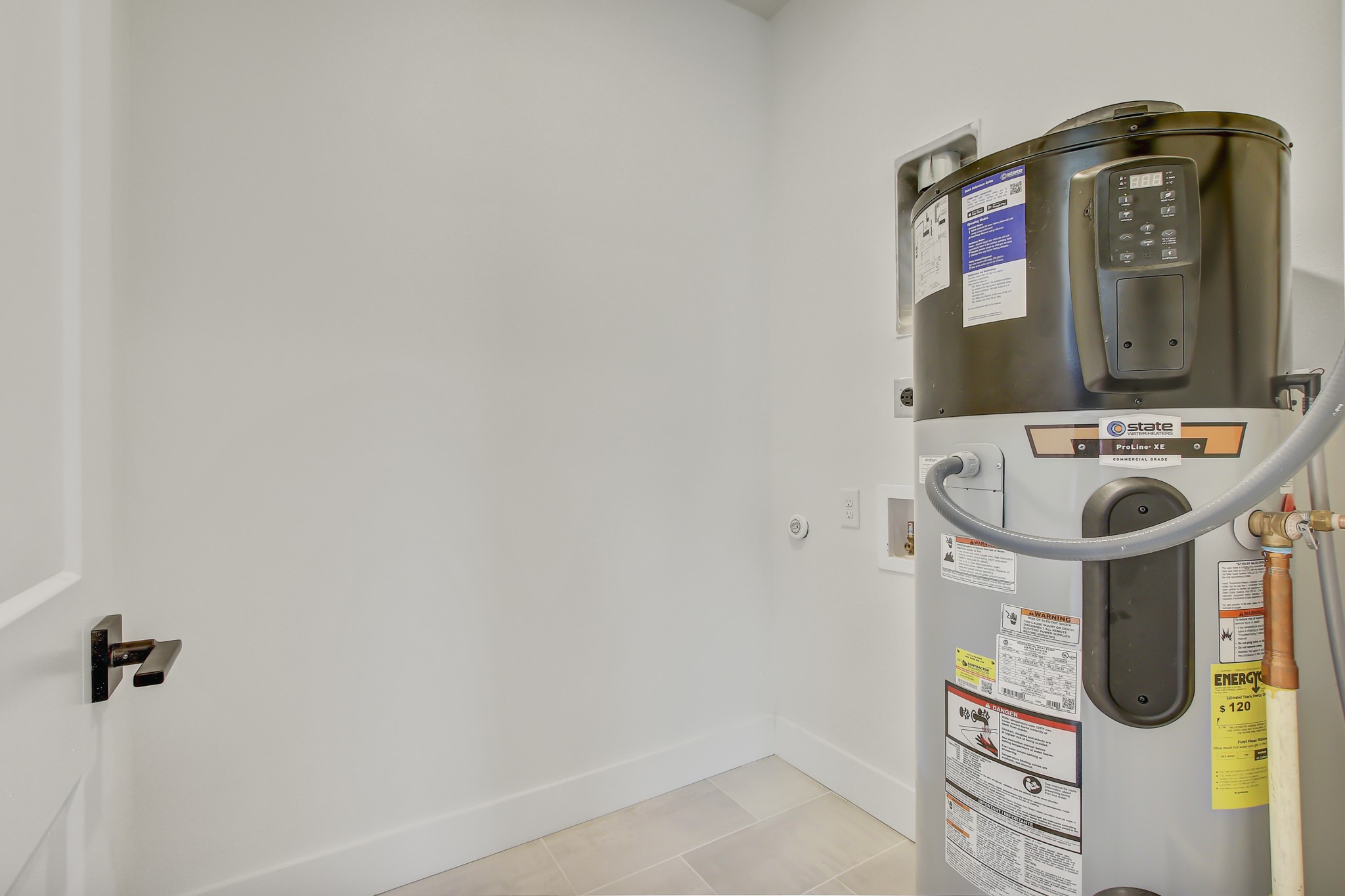 4127 East 12th Street, Unit 8 Austin, TX 78721 - Photo 25 of 32 Utility room featuring water heater