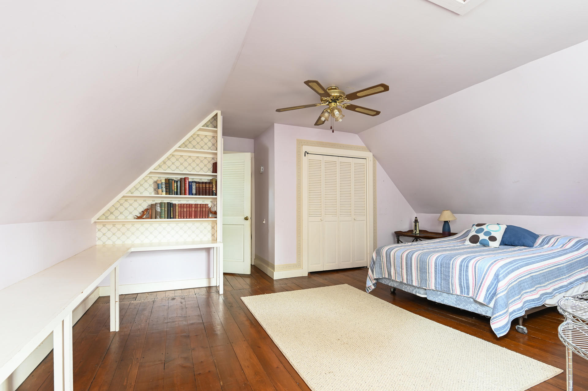 56 Depot Road Harwich, MA 02671 - Photo 10 of 25 a bedroom with a bed a window and a potted plant on the table