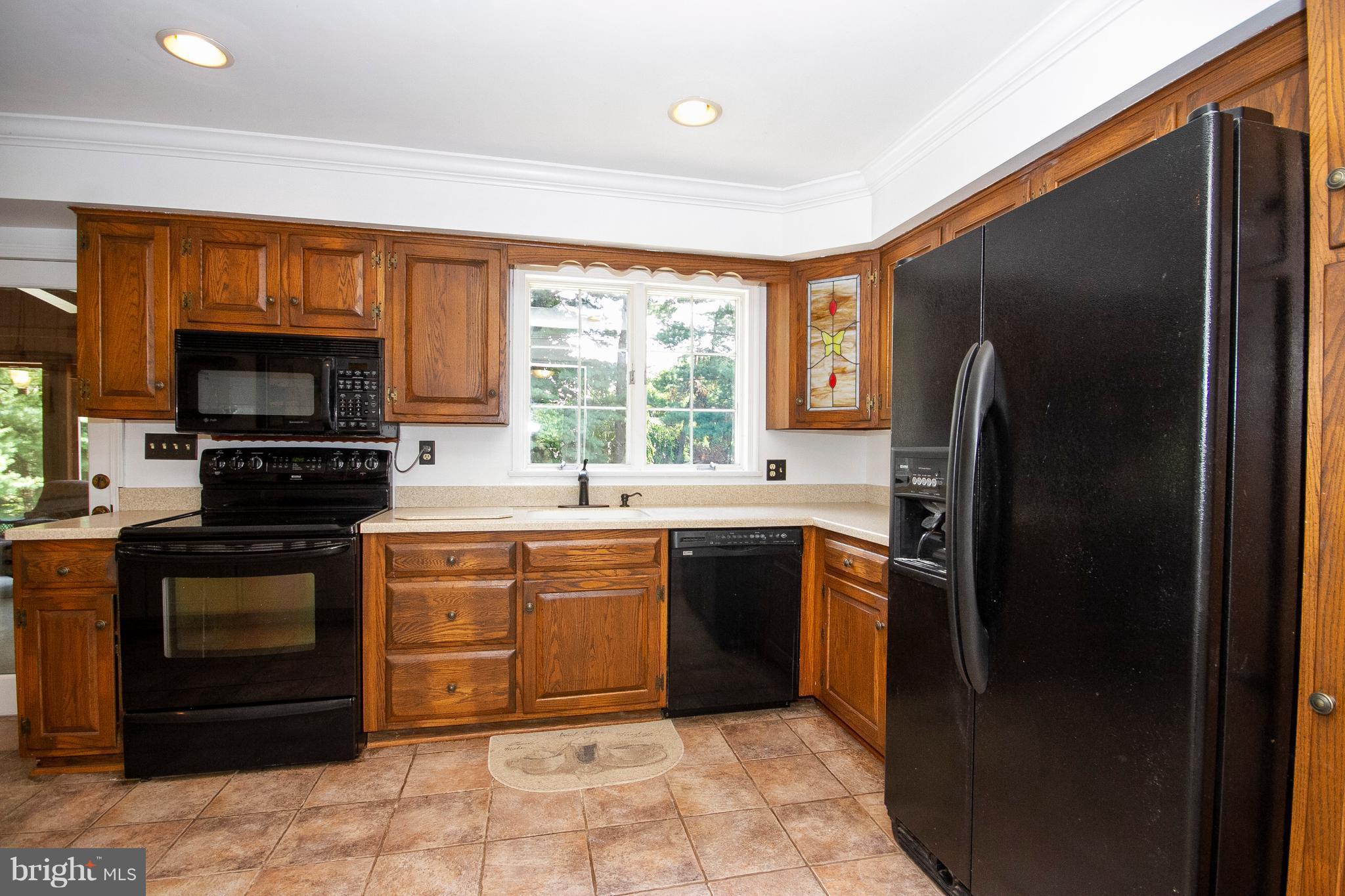 1907 Springview Court Fallston, MD 21047 - Photo 11 of 30 a kitchen with stainless steel appliances granite countertop a refrigerator stove and sink