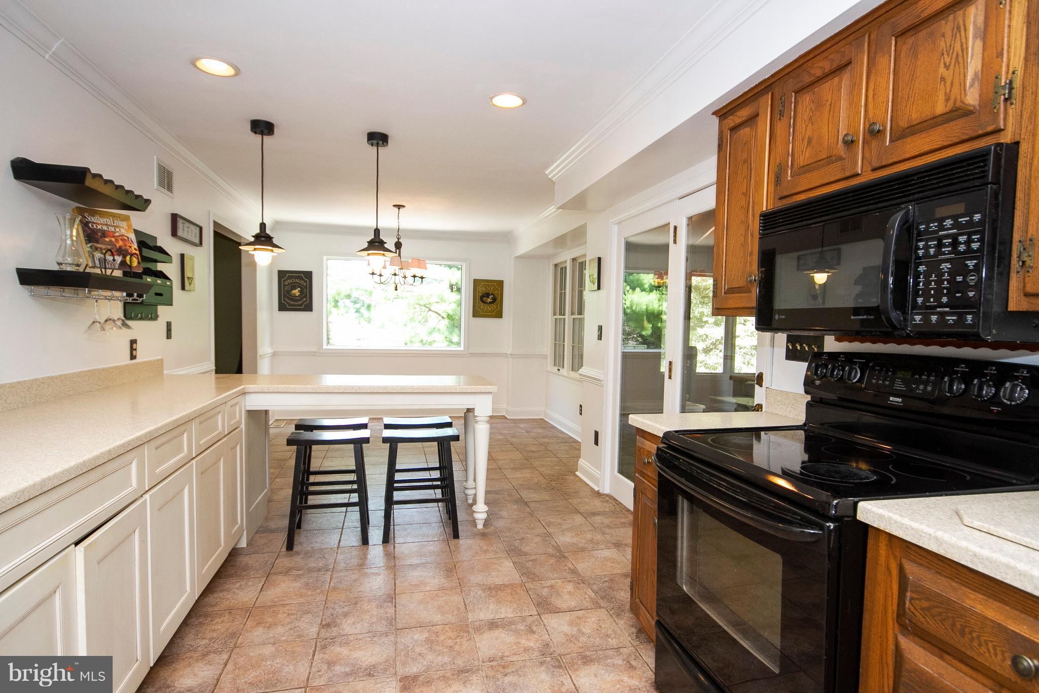 1907 Springview Court Fallston, MD 21047 - Photo 13 of 30 a kitchen with kitchen island granite countertop a stove and a sink