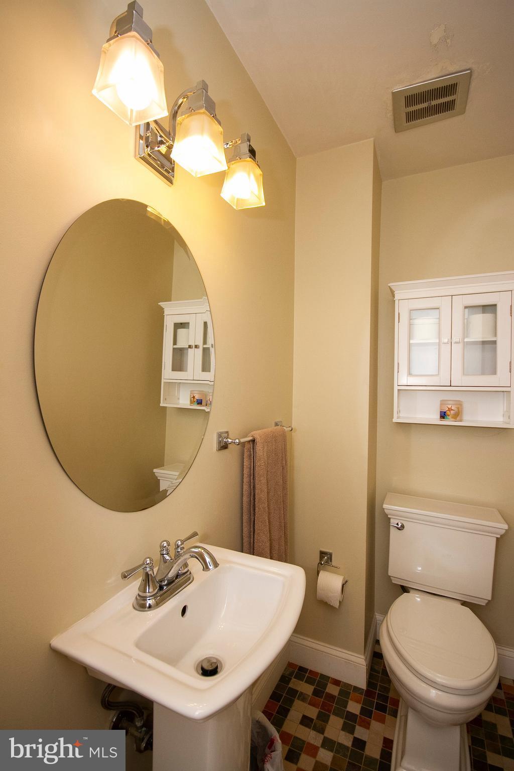 1907 Springview Court Fallston, MD 21047 - Photo 16 of 30 a bathroom with a sink a toilet and mirror