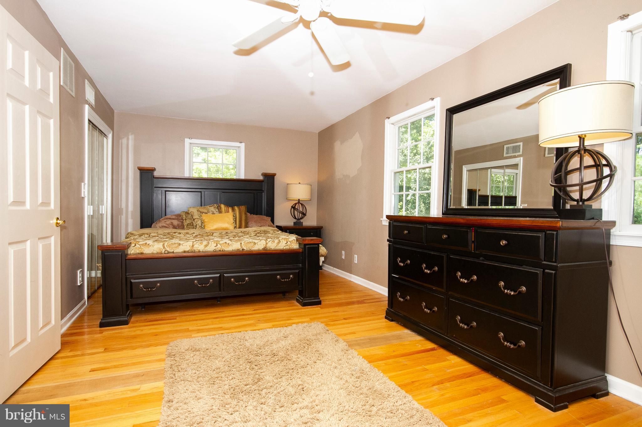 1907 Springview Court Fallston, MD 21047 - Photo 17 of 30 a spacious bedroom with a bed and a dresser