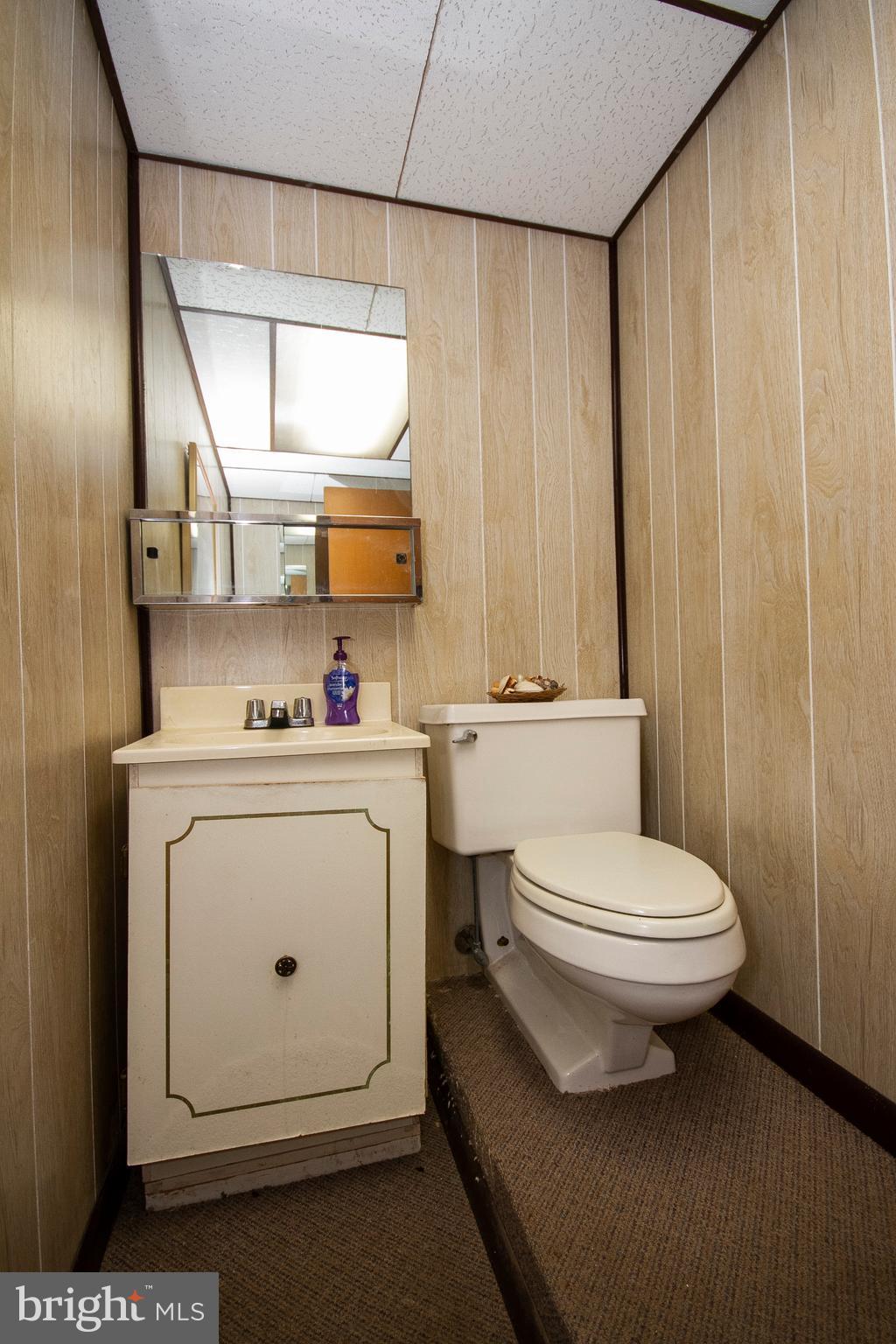 1907 Springview Court Fallston, MD 21047 - Photo 30 of 30 a white toilet sitting next to a bathroom sink