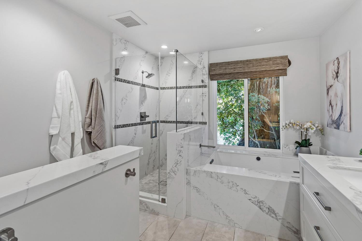 1013 Copper Lake Court Modesto, CA 95355 - Photo 21 of 66 a bathroom with a tub sink and a mirror