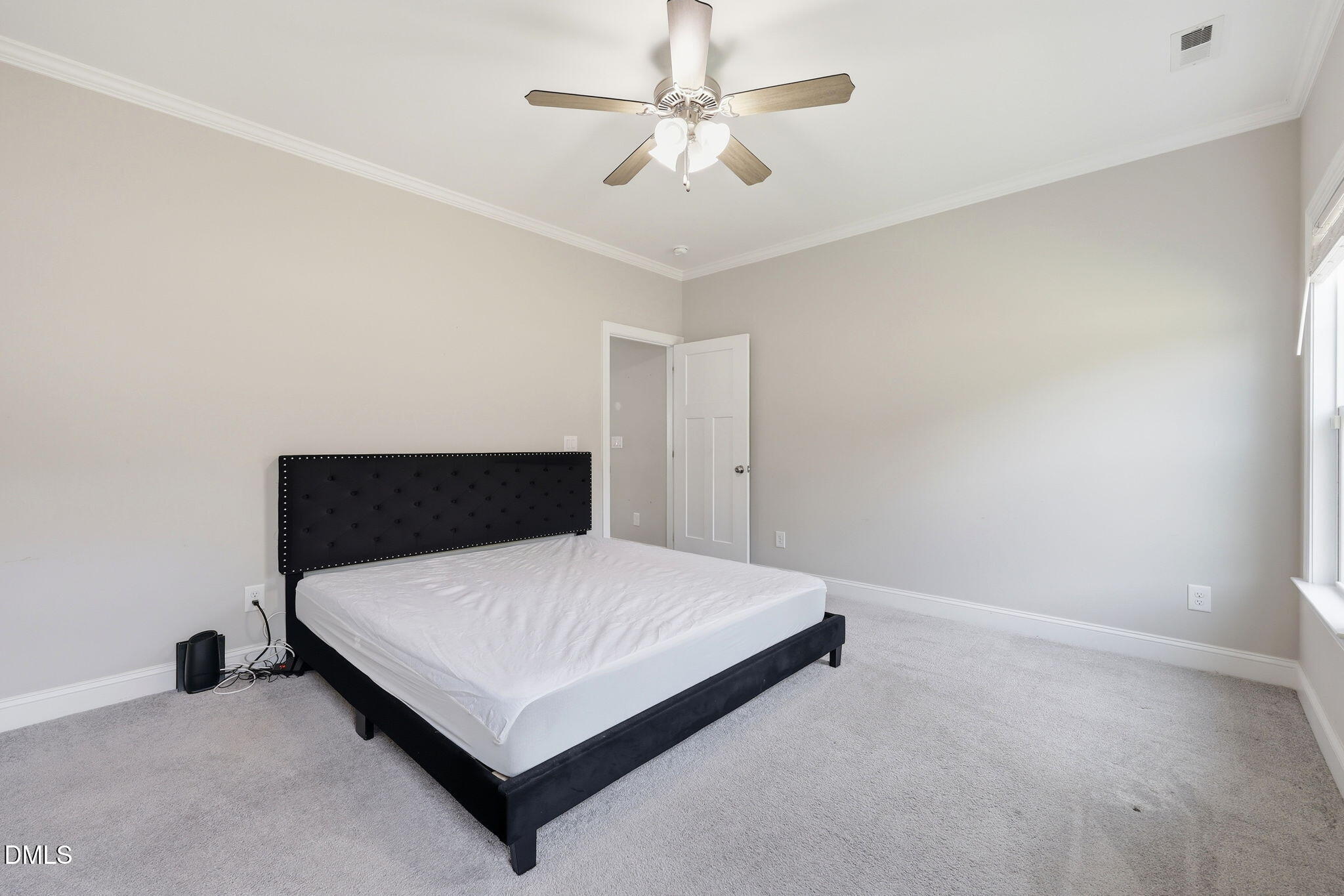 709 South Pollock Street Selma, NC 27576 - Photo 20 of 30 a bedroom with a bed and window