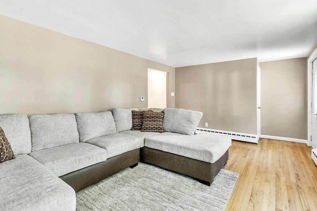 140 Talbot Road Springfield, MA 01119 - Photo 17 of 41 a living room with a couch and wooden floor