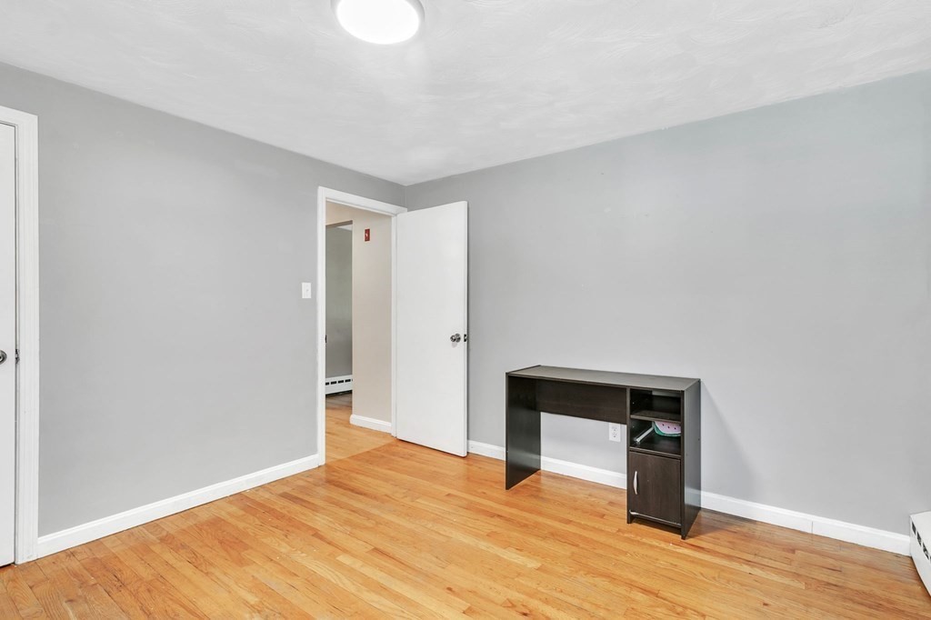 140 Talbot Road Springfield, MA 01119 - Photo 23 of 41 a view of an empty room with wooden floor