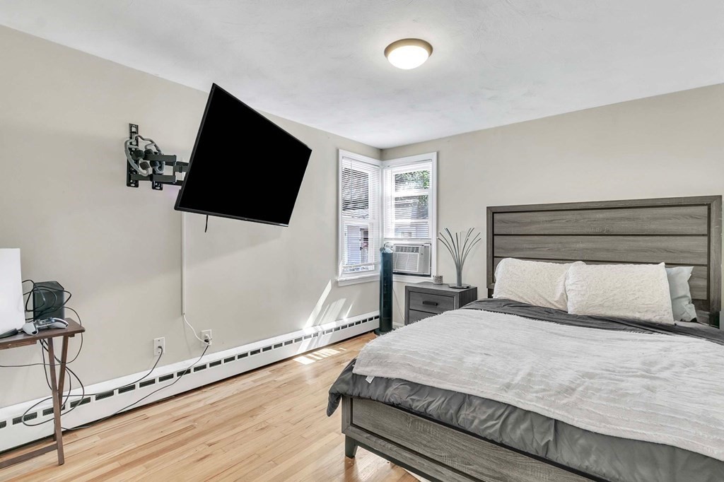 140 Talbot Road Springfield, MA 01119 - Photo 29 of 41 a bedroom with a bed and a flat screen tv
