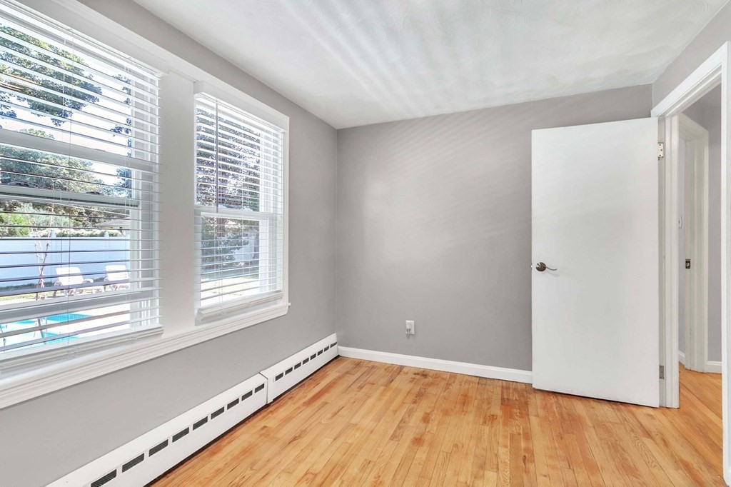 140 Talbot Road Springfield, MA 01119 - Photo 31 of 41 a view of an empty room with wooden floor and a window