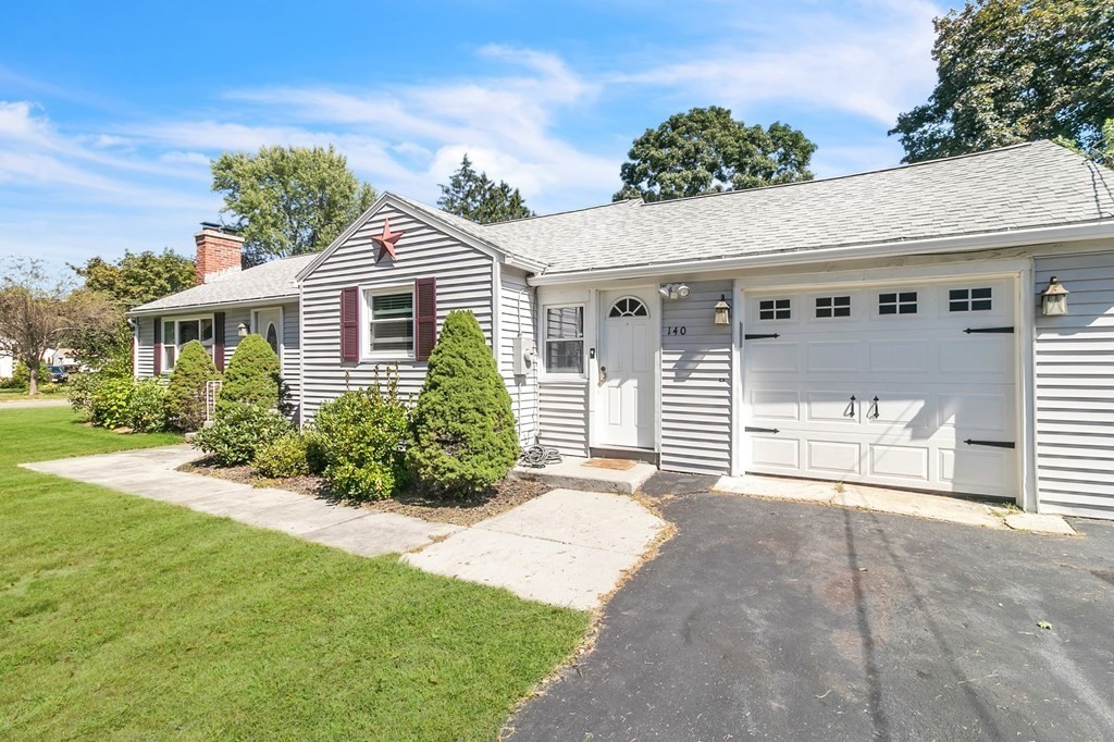 140 Talbot Road Springfield, MA 01119 - Photo 4 of 41 a front view of a house with a garden and plants