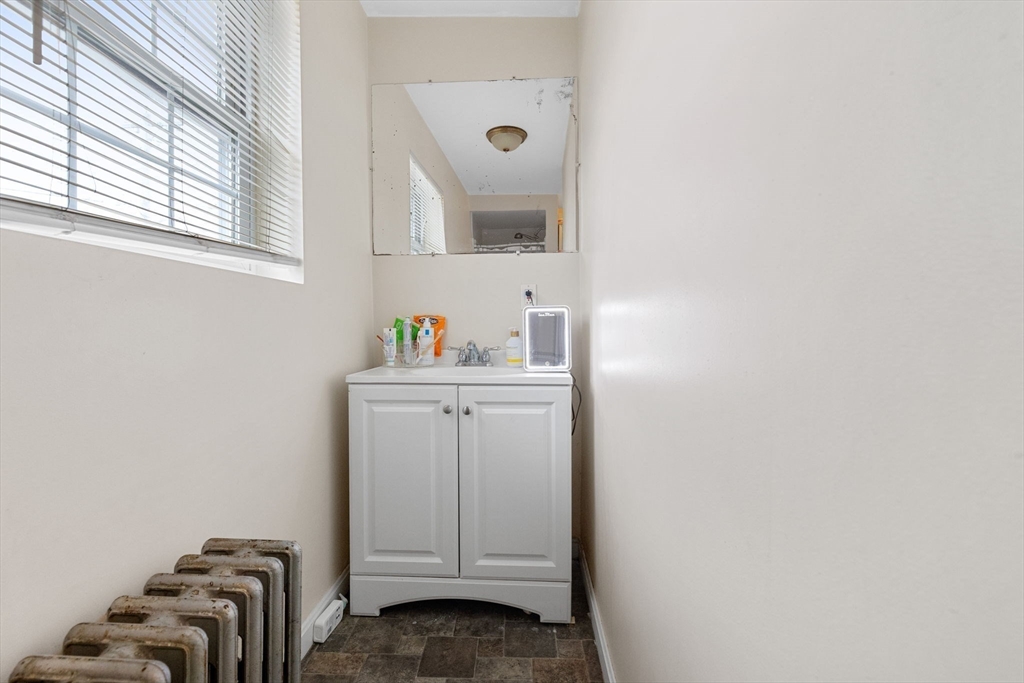 19 Alfred Street, Unit 2 Everett, MA 02149 - Photo 11 of 14 a bathroom with a sink and a mirror