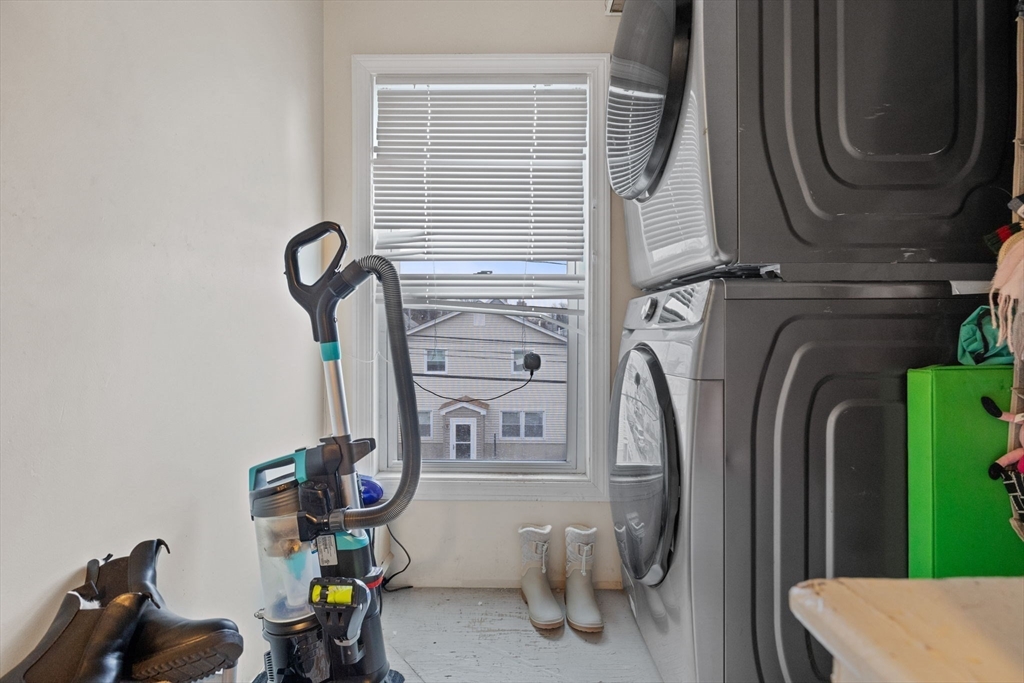 19 Alfred Street, Unit 2 Everett, MA 02149 - Photo 12 of 14 a close view of walk in closet with clothes