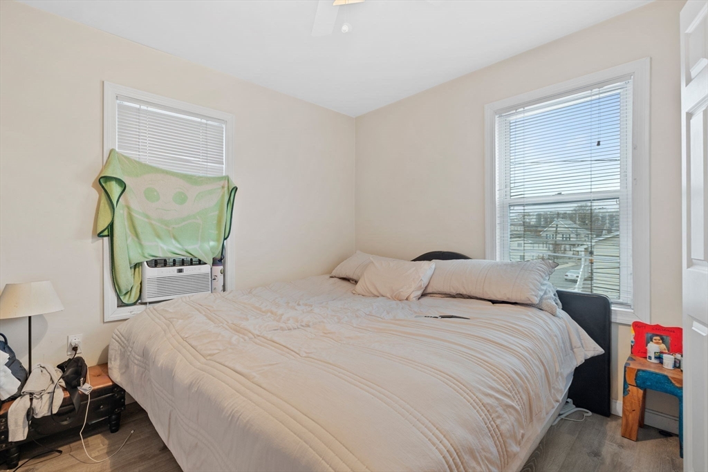 19 Alfred Street, Unit 2 Everett, MA 02149 - Photo 7 of 14 a bedroom with a bed and a window