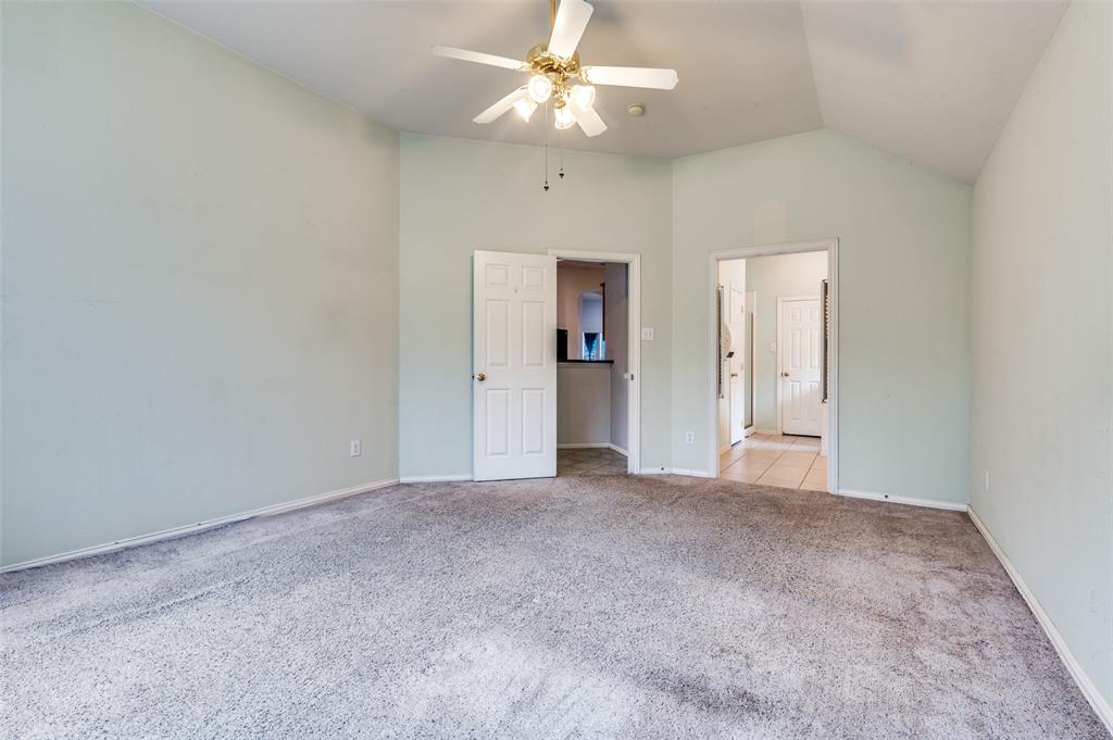 8530 Quicksilver Drive Dallas, TX 75249 - Photo 14 of 25 an empty room with fan and entryway